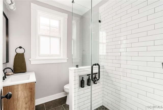 full bathroom featuring vanity, tile patterned floors, toilet, and a stall shower