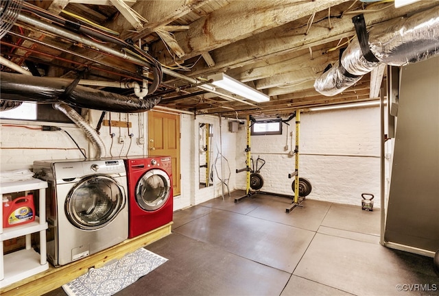 clothes washing area featuring laundry area and washing machine and dryer