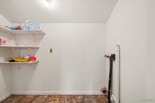 laundry room with baseboards