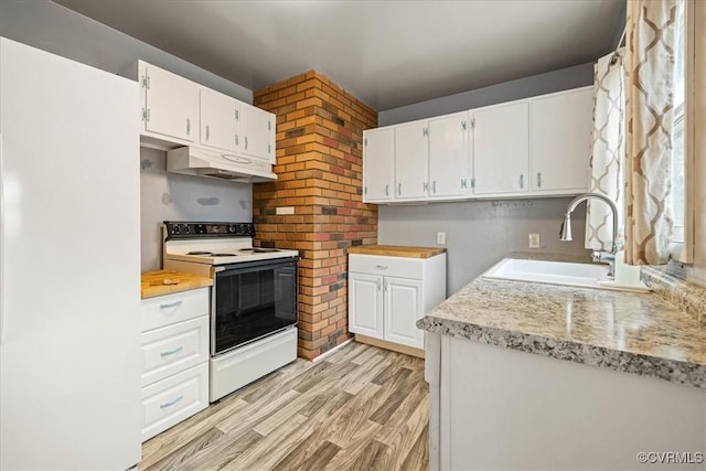 kitchen featuring under cabinet range hood, light countertops, white range with electric stovetop, white cabinetry, and a sink