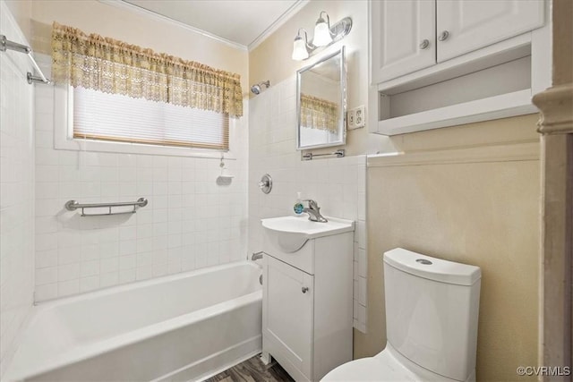 bathroom with vanity, toilet, shower / bathtub combination, and ornamental molding