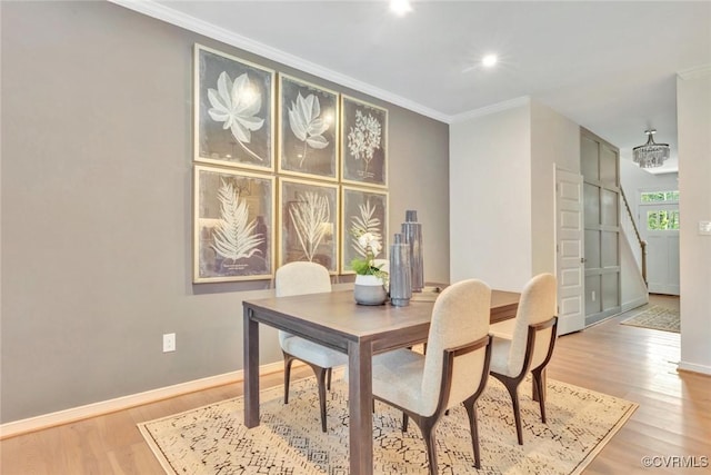 dining space with crown molding, recessed lighting, wood finished floors, and baseboards