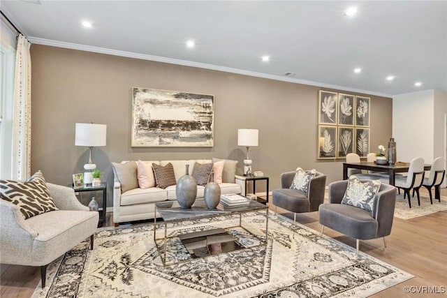 living room with recessed lighting, wood finished floors, and crown molding