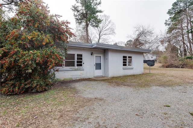 view of front of property featuring concrete block siding