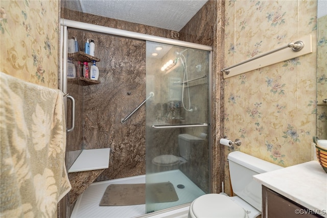 bathroom featuring toilet, a shower stall, and wallpapered walls