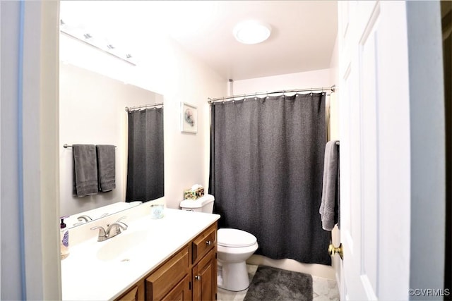 bathroom with toilet and vanity