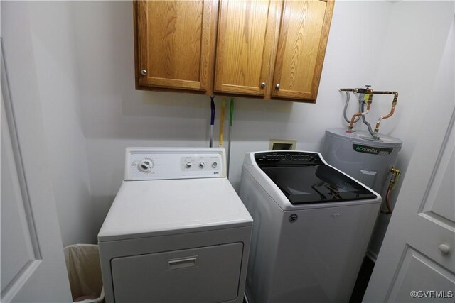 laundry area with cabinet space and separate washer and dryer