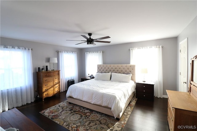 bedroom featuring dark wood-style flooring and ceiling fan