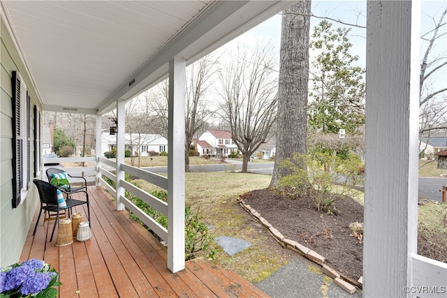 wooden terrace with a porch