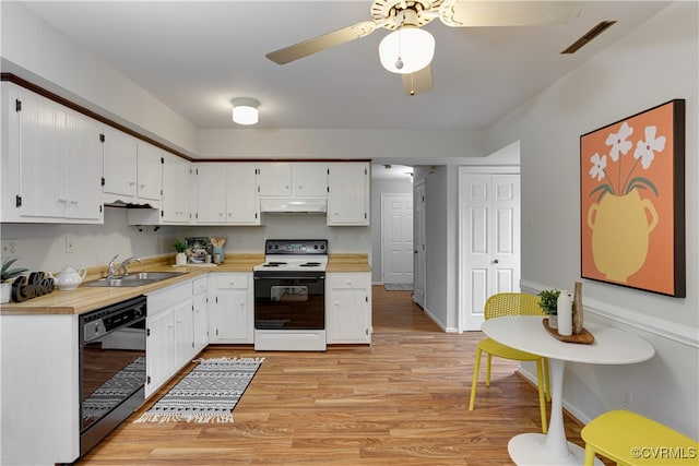 kitchen featuring dishwasher, light countertops, electric stove, and a sink