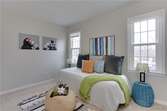 bedroom featuring baseboards and carpet floors