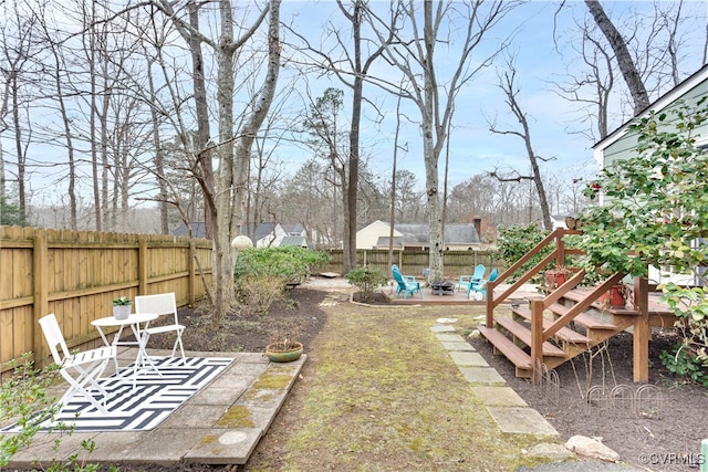 view of yard with a patio area and a fenced backyard