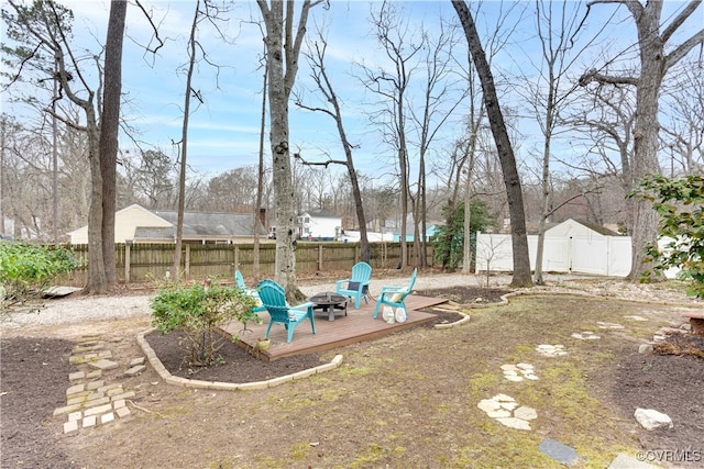 view of yard featuring a fire pit and a fenced backyard