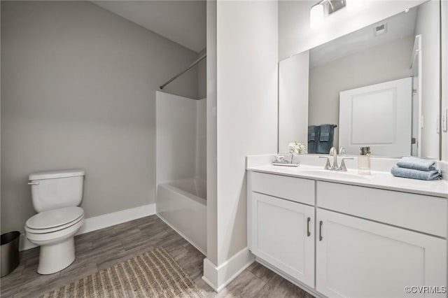 bathroom with visible vents, toilet, shower / tub combination, baseboards, and vanity