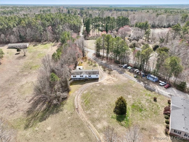 drone / aerial view with a rural view and a view of trees