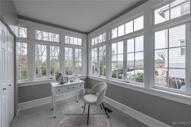 sunroom / solarium with a wealth of natural light and visible vents