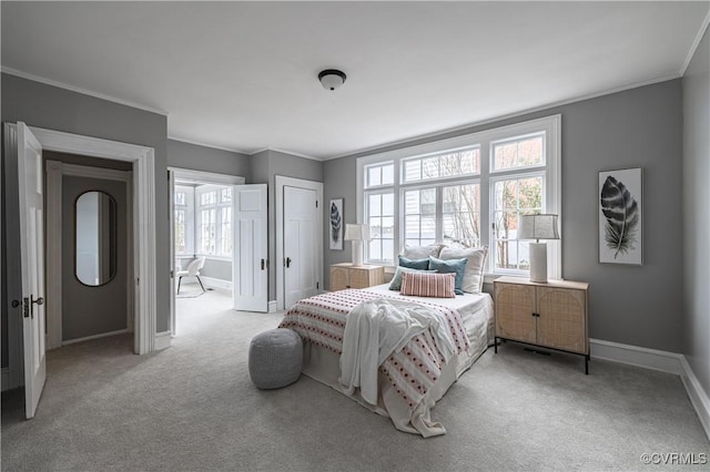 bedroom with multiple windows, baseboards, carpet floors, and ornamental molding