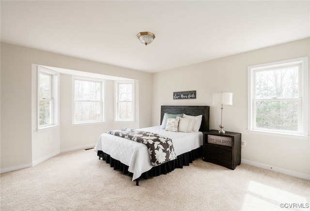 bedroom featuring carpet flooring and baseboards