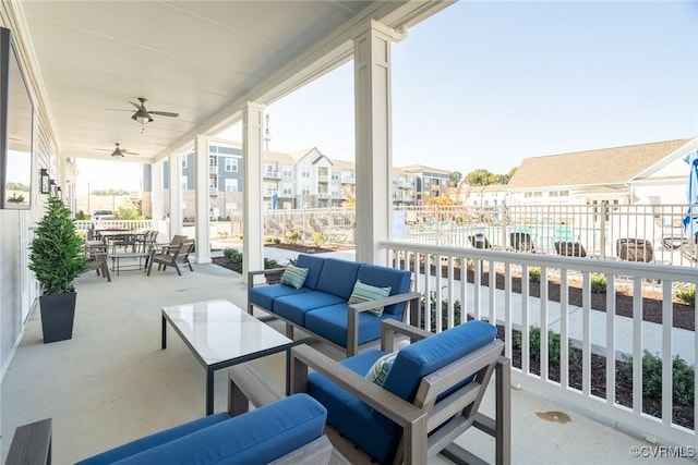 view of patio / terrace with a residential view, outdoor dining space, outdoor lounge area, and ceiling fan