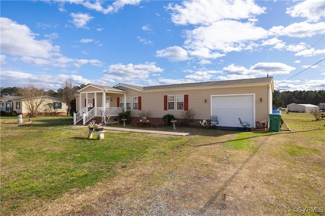 ranch-style home with a front lawn, a porch, a garage, and driveway