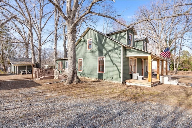 exterior space featuring a deck and covered porch