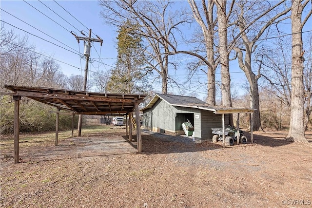 view of outbuilding featuring an outdoor structure and dirt driveway