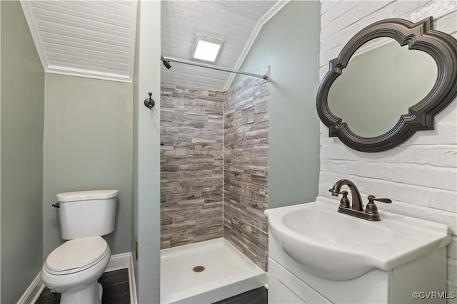 full bath with toilet, a shower stall, crown molding, vanity, and vaulted ceiling