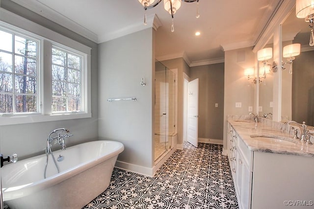 bathroom with baseboards, a freestanding bath, ornamental molding, a shower stall, and tile patterned floors