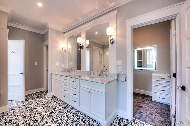 full bath featuring a sink, baseboards, double vanity, and crown molding