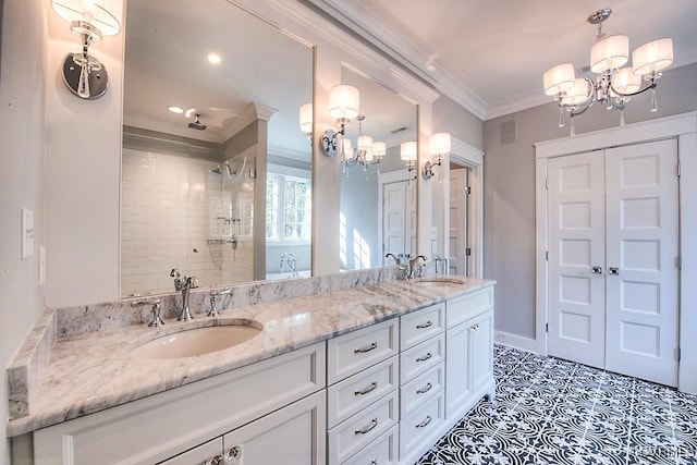 full bath featuring a sink, an inviting chandelier, tiled shower, and ornamental molding