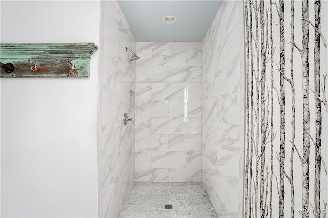 full bathroom with a tile shower