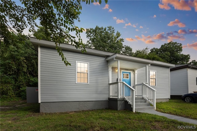 view of front of property with a yard