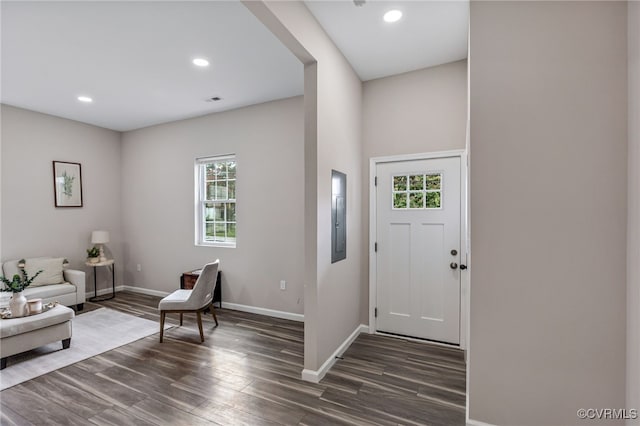 entryway with wood finished floors, visible vents, baseboards, electric panel, and recessed lighting