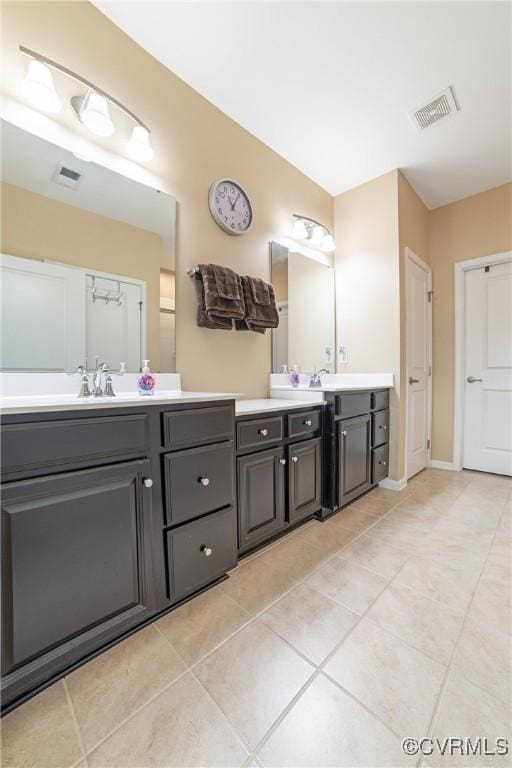 bathroom featuring visible vents, vanity, and tile patterned flooring