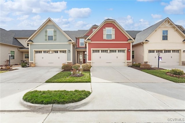 craftsman house with concrete driveway and board and batten siding