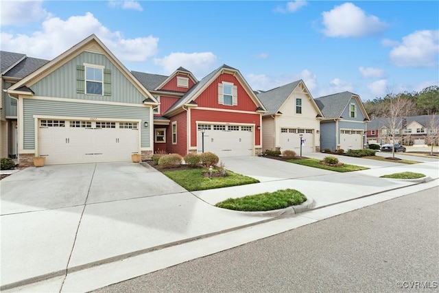 view of front of property with a residential view, board and batten siding, concrete driveway, and an attached garage