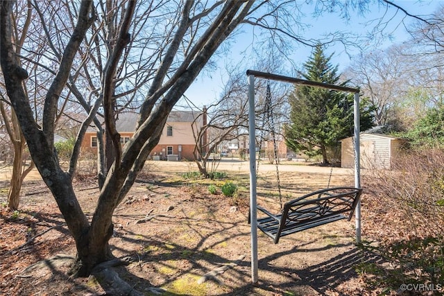 view of yard with an outdoor structure and a shed