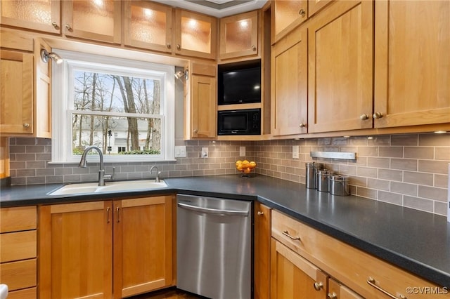 kitchen featuring dark countertops, backsplash, black microwave, dishwasher, and a sink