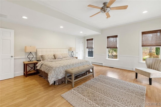 bedroom featuring recessed lighting, a wainscoted wall, light wood-style flooring, and ornamental molding