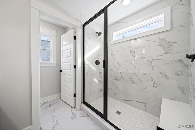 full bathroom featuring baseboards, marble finish floor, and a marble finish shower