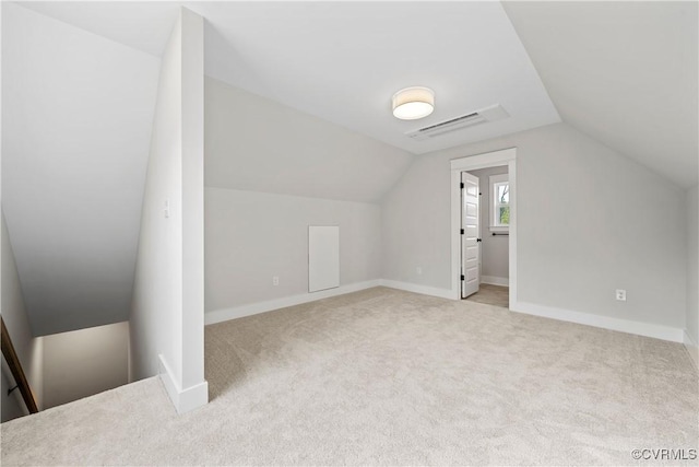 bonus room featuring vaulted ceiling, carpet flooring, visible vents, and baseboards