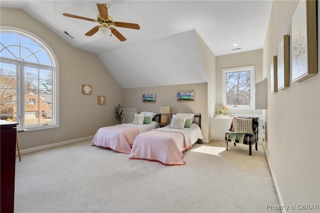 bedroom with vaulted ceiling, carpet flooring, baseboards, and visible vents