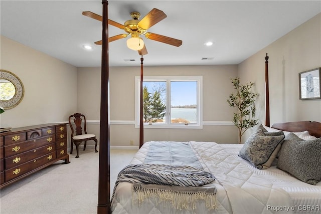 bedroom featuring recessed lighting, light colored carpet, and visible vents