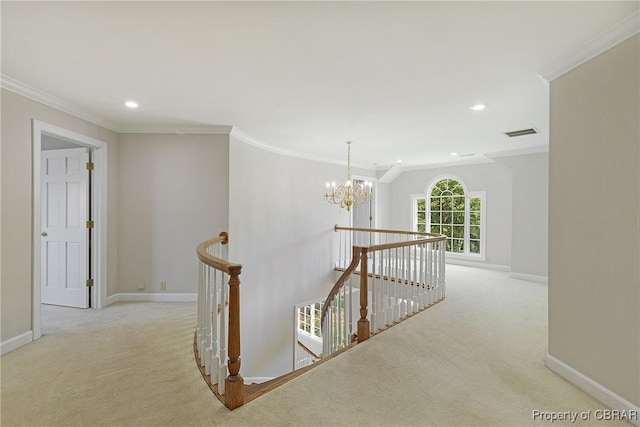 hallway featuring baseboards, an upstairs landing, ornamental molding, and carpet flooring