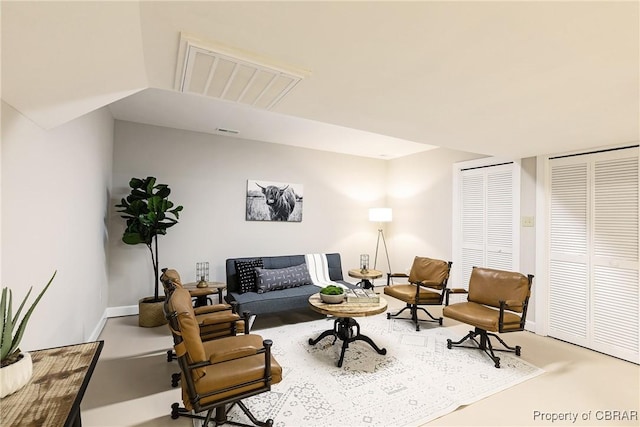 living room featuring visible vents and baseboards