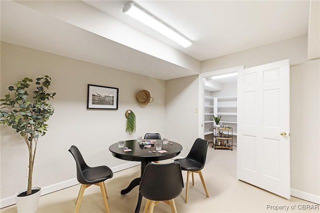 dining room featuring baseboards