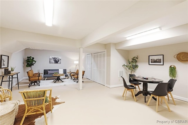 interior space featuring visible vents, baseboards, and vaulted ceiling