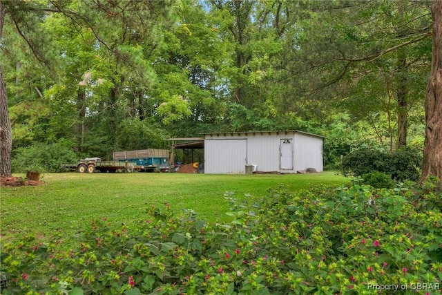 view of yard with a storage shed and an outbuilding