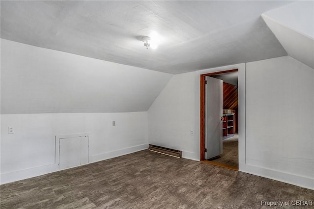 bonus room featuring baseboards, lofted ceiling, and wood finished floors