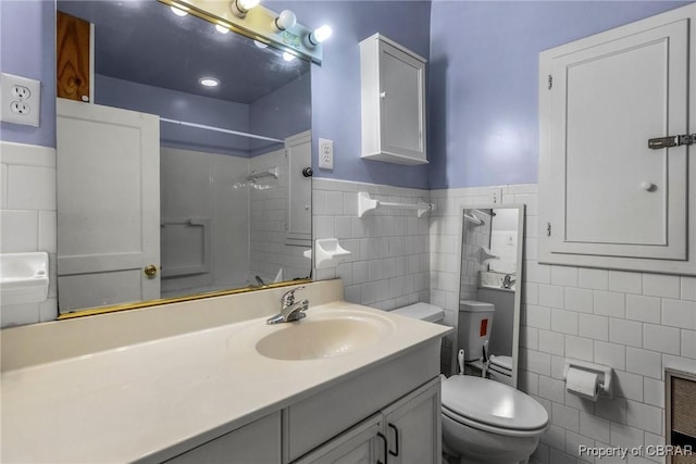 full bathroom with walk in shower, toilet, vanity, heating unit, and tile walls